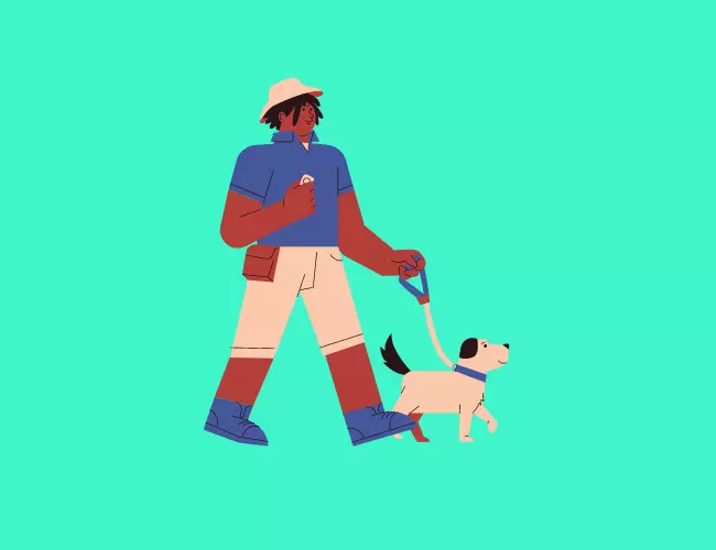 A Man Walking With A Dog