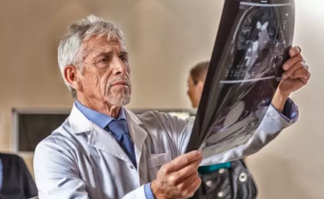 A Male Doctor Checking An X-Ray