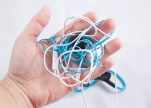 A Picture Of A Handsfree With Tangled Wires